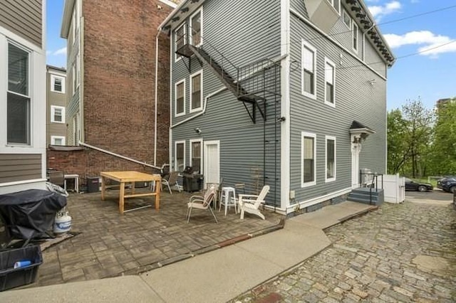 rear view of property featuring a patio
