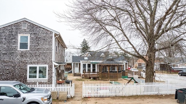 rear view of property featuring a deck