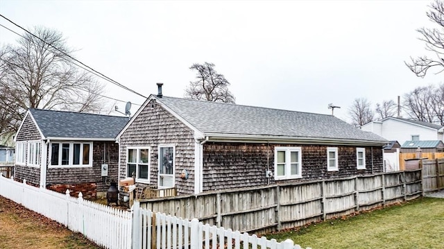 rear view of house with a lawn