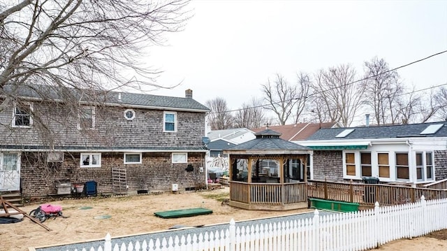 back of house featuring a gazebo