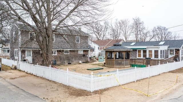 view of front of house with a sunroom