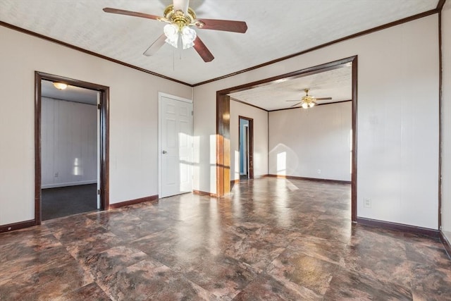 spare room with ceiling fan and crown molding