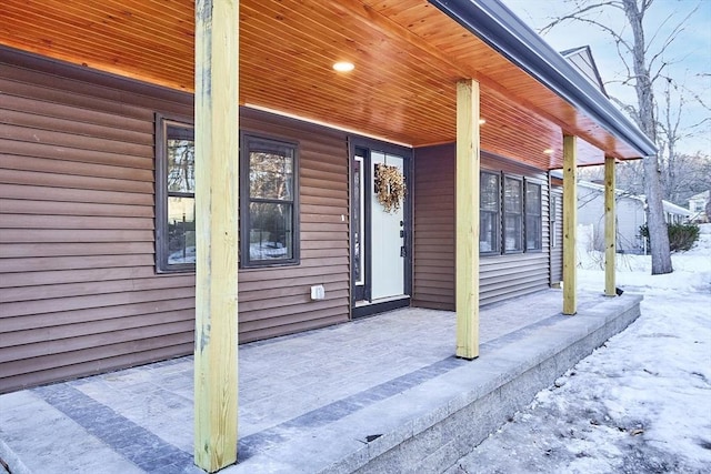 entrance to property featuring a porch