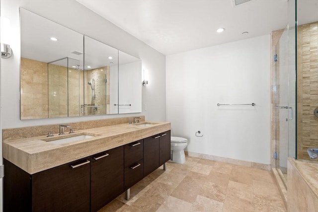 bathroom featuring vanity, toilet, and walk in shower