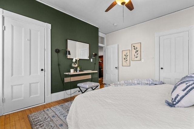 bedroom featuring ceiling fan and wood-type flooring