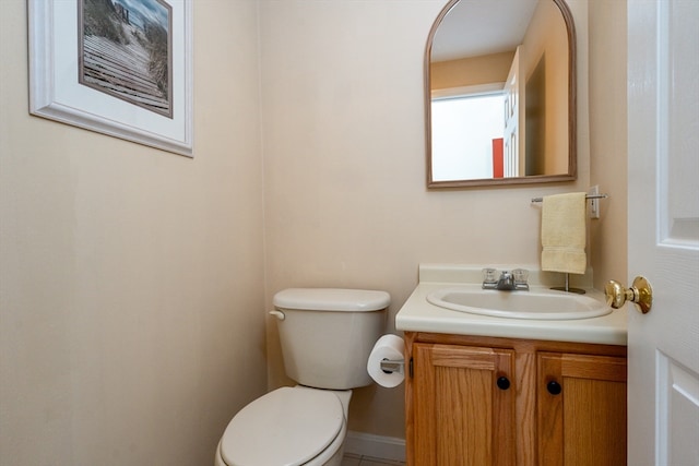 bathroom featuring toilet and vanity