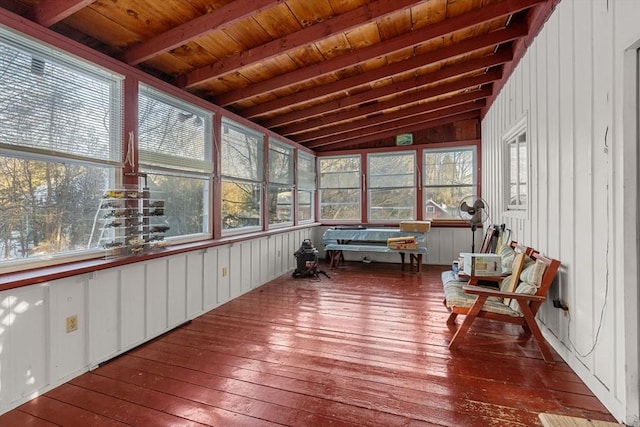 sunroom featuring wooden ceiling and lofted ceiling with beams