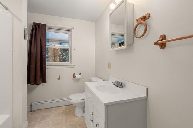 bathroom featuring toilet, a baseboard heating unit, vanity, baseboards, and tile patterned floors