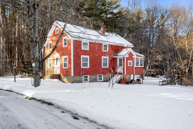 view of front of home featuring a chimney