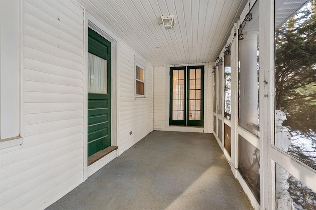 unfurnished sunroom featuring wooden ceiling