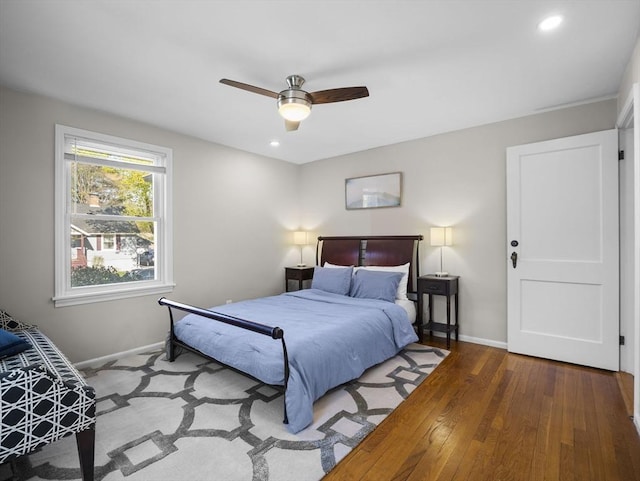 bedroom featuring recessed lighting, baseboards, and wood finished floors