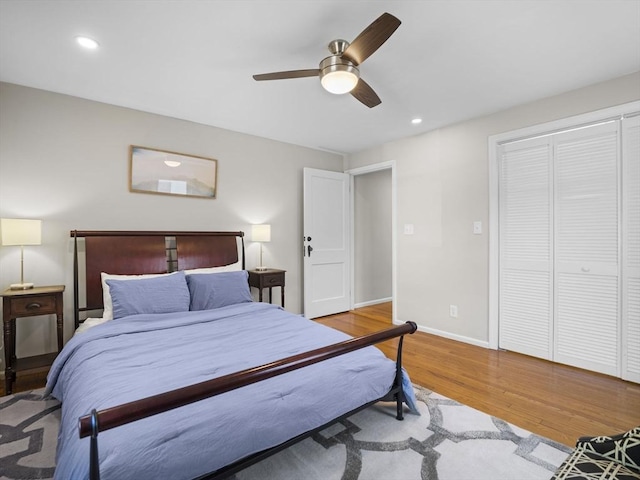 bedroom featuring a ceiling fan, baseboards, recessed lighting, and wood finished floors