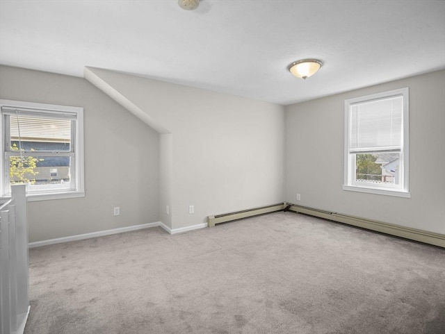 bonus room with carpet flooring, baseboards, and a baseboard radiator