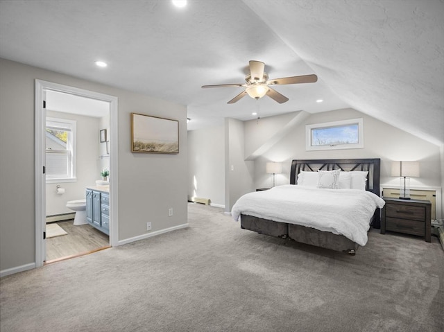 carpeted bedroom featuring recessed lighting, baseboards, vaulted ceiling, and baseboard heating