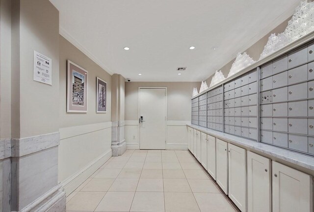 view of community featuring wainscoting, mail area, crown molding, and recessed lighting