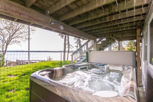 87 Lewis Point Rd, Bourne, MA 02532 - view of patio / terrace with a hot tub, a water view, and stairway