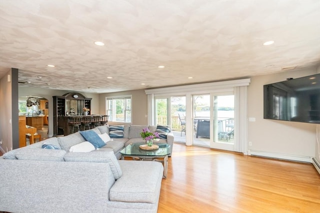 87 Lewis Point Rd, Bourne, MA 02532 - living room featuring recessed lighting, light wood-style flooring, and a bar