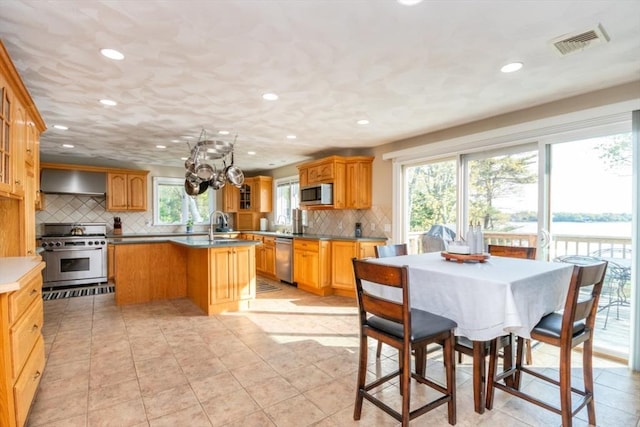 87 Lewis Point Rd, Bourne, MA 02532 - dining area with recessed lighting, light tile patterned floors, and a chandelier