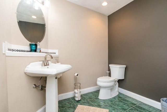 87 Lewis Point Rd, Bourne, MA 02532 - half bath with toilet, baseboards, and tile patterned floors