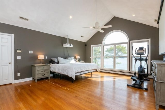 87 Lewis Point Rd, Bourne, MA 02532 - bedroom with baseboard heating, wood finished floors, high vaulted ceiling, recessed lighting, and baseboards