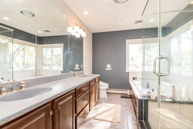 87 Lewis Point Rd, Bourne, MA 02532 - full bath featuring baseboard heating, toilet, double vanity, a garden tub, and tile patterned flooring