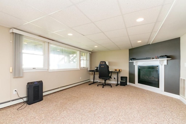 87 Lewis Point Rd, Bourne, MA 02532 - office with a baseboard heating unit, carpet flooring, a glass covered fireplace, recessed lighting, and a paneled ceiling