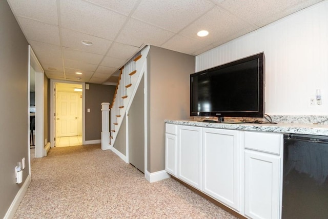 87 Lewis Point Rd, Bourne, MA 02532 - unfurnished living room with stairs, light carpet, recessed lighting, a drop ceiling, and baseboards