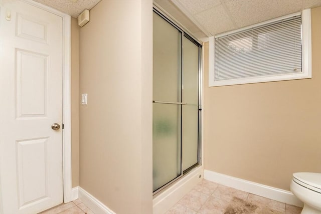 87 Lewis Point Rd, Bourne, MA 02532 - bathroom featuring baseboards, an enclosed shower, toilet, and a paneled ceiling