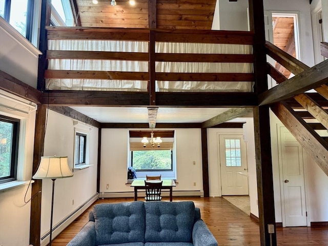1962 Shelburne Falls Rd, Conway, MA 01341 - living room featuring stairway, baseboard heating, wood finished floors, and a chandelier