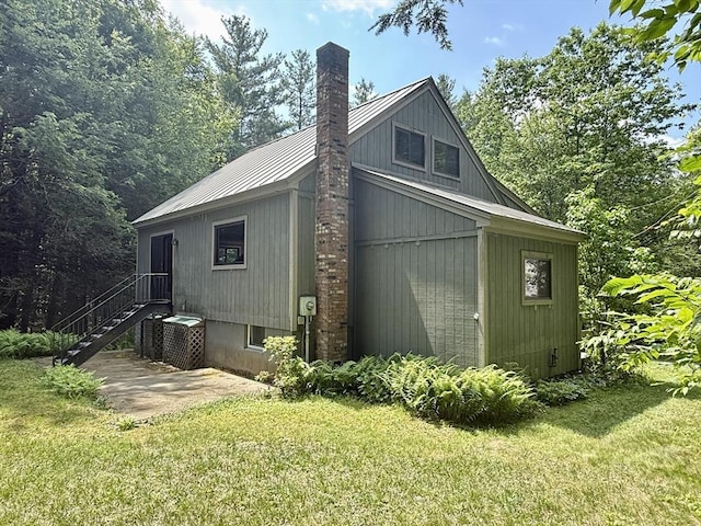 1962 Shelburne Falls Rd, Conway, MA 01341 - view of side of property featuring a yard, a metal roof, and a chimney