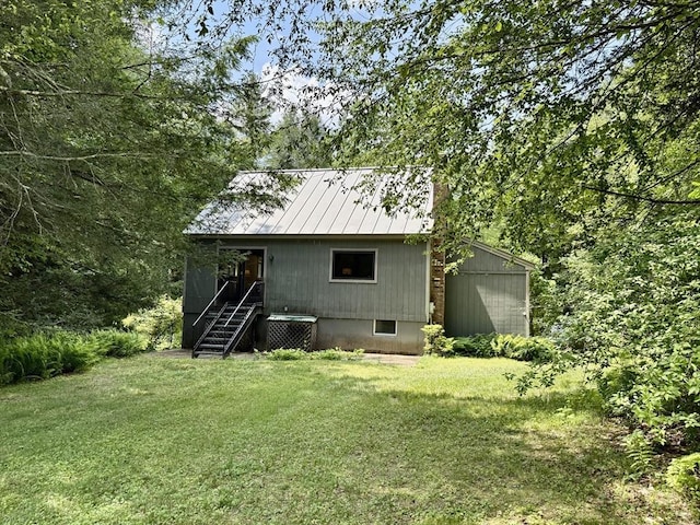 1962 Shelburne Falls Rd, Conway, MA 01341 - back of property with a lawn, a metal roof, and a standing seam roof