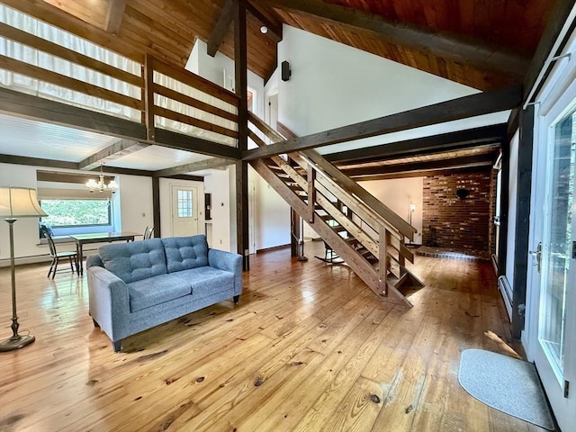 1962 Shelburne Falls Rd, Conway, MA 01341 - living room with stairway, a chandelier, hardwood / wood-style floors, high vaulted ceiling, and a wooden ceiling with exposed beams