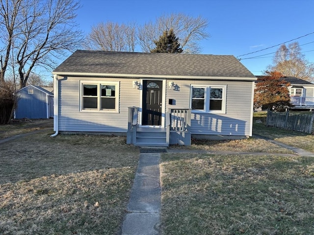 bungalow with a front yard