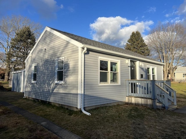 view of home's exterior with a lawn