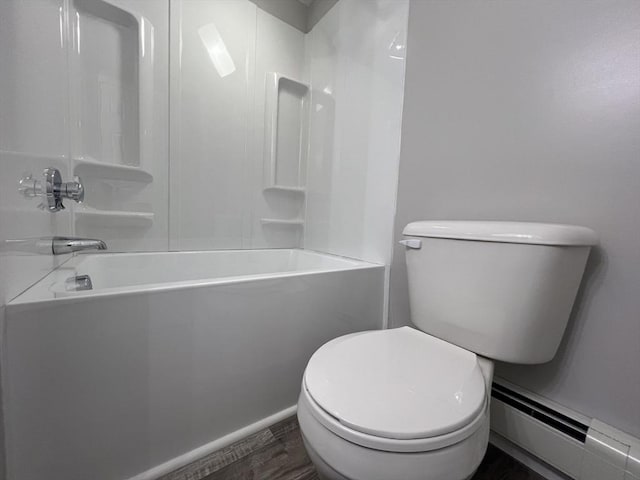 bathroom with toilet, hardwood / wood-style floors,  shower combination, and a baseboard heating unit