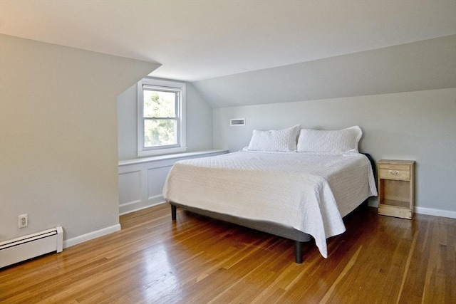 58 Lakeshore Ave, Beverly, MA 01915 - bedroom featuring a baseboard radiator, lofted ceiling, and wood finished floors