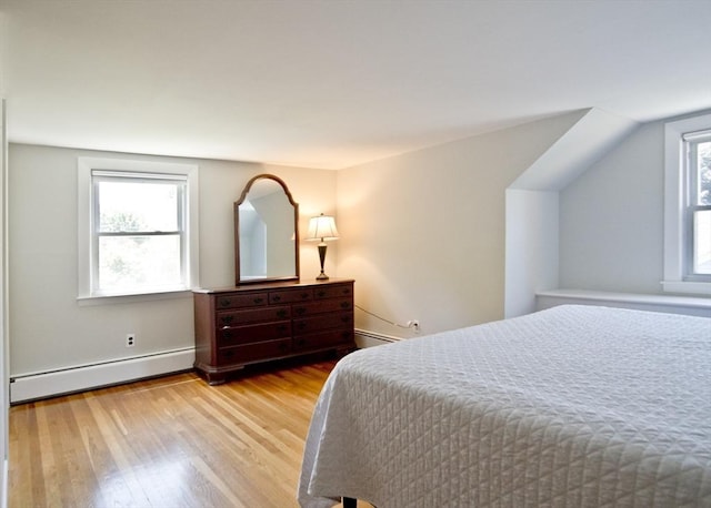 58 Lakeshore Ave, Beverly, MA 01915 - bedroom featuring a baseboard heating unit and wood finished floors