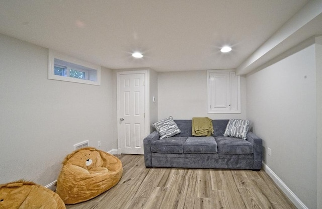 58 Lakeshore Ave, Beverly, MA 01915 - sitting room with light wood finished floors and recessed lighting