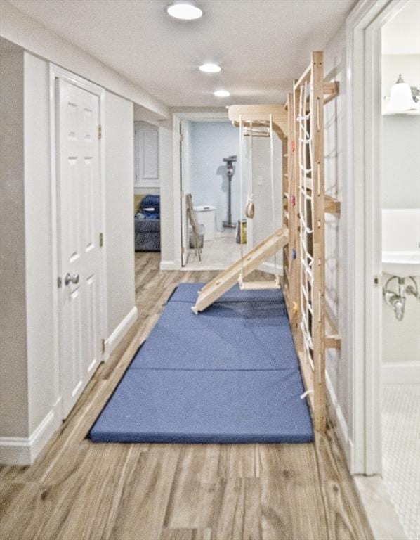 58 Lakeshore Ave, Beverly, MA 01915 - workout room with wood finished floors and recessed lighting
