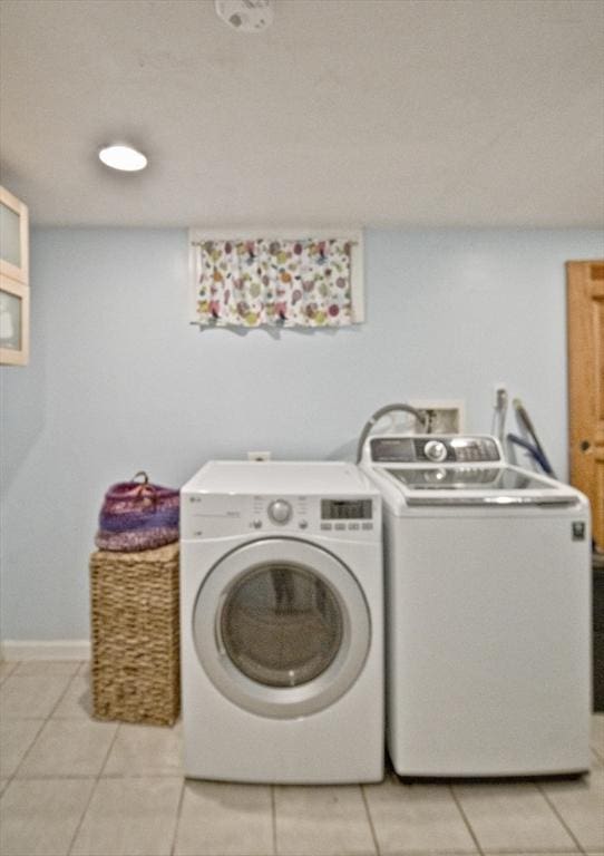 58 Lakeshore Ave, Beverly, MA 01915 - laundry area featuring washing machine and clothes dryer and light tile patterned floors