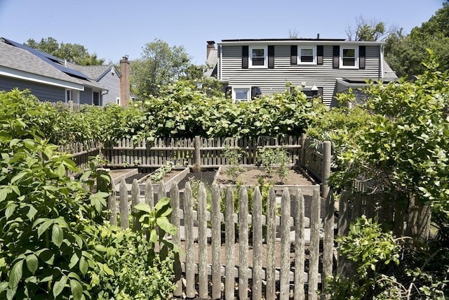 58 Lakeshore Ave, Beverly, MA 01915 - rear view of property featuring a garden