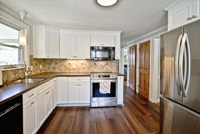 58 Lakeshore Ave, Beverly, MA 01915 - kitchen featuring black appliances, dark wood finished floors, tasteful backsplash, white cabinets, and crown molding