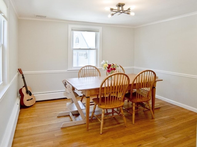 58 Lakeshore Ave, Beverly, MA 01915 - dining room featuring ornamental molding, a chandelier, light wood-style floors, and a baseboard radiator