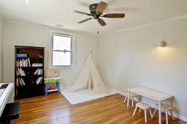 58 Lakeshore Ave, Beverly, MA 01915 - game room featuring light wood-style flooring, a ceiling fan, and crown molding