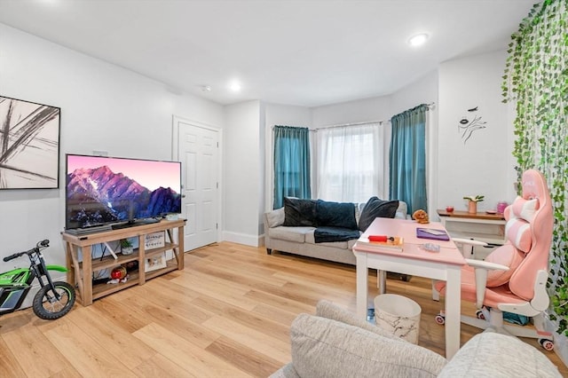 12 Chestnut Ave, Lynn, MA 01902 - living room with wood finished floors, recessed lighting, and baseboards