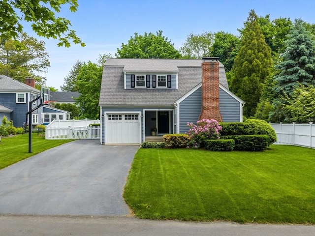 45 Shirley Rd, Wellesley, MA 02482 - view of front facade with driveway, a chimney, and a shingled roof