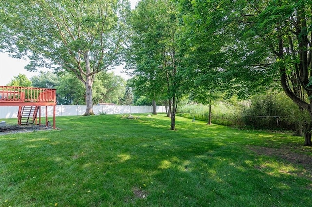 13 Laura Ln, Norton, MA 02766 - fenced backyard with stairs and a deck