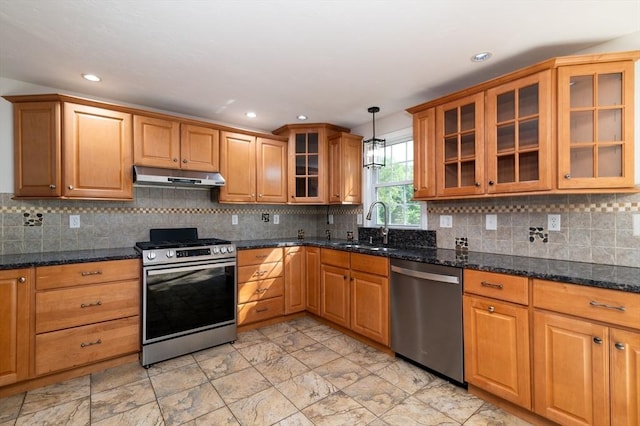 13 Laura Ln, Norton, MA 02766 - kitchen featuring appliances with stainless steel finishes, under cabinet range hood, pendant lighting, glass insert cabinets, and dark stone countertops