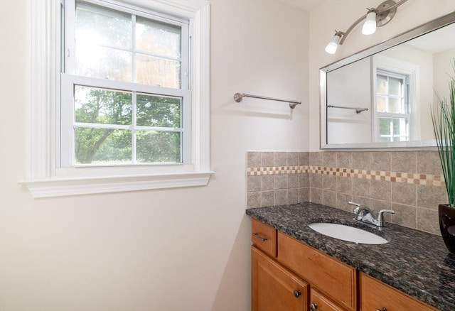 13 Laura Ln, Norton, MA 02766 - bathroom featuring vanity, healthy amount of natural light, and decorative backsplash