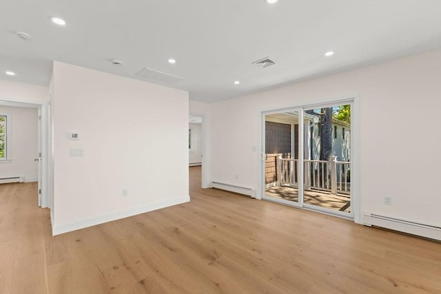 unfurnished room with light wood-style flooring, plenty of natural light, and recessed lighting